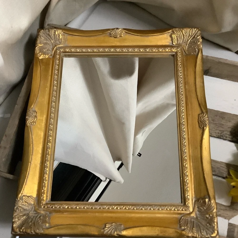 Ornate Gold Wall Mirror with Decorative Frame